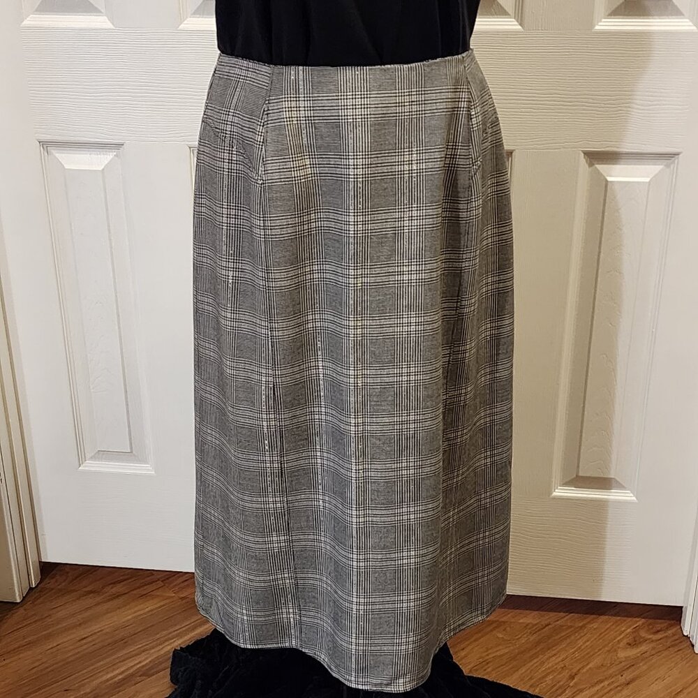 Black & white plaid skirt with kick-pleat button details on the back hem